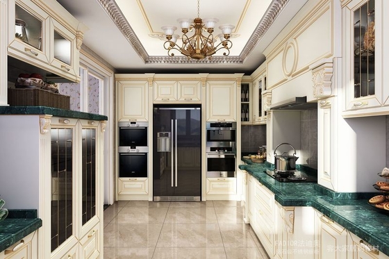 Opulent and Refined Custom Stainless Steel Kitchen Cabinetry with Deep Green Marble Countertop and Soft-Close Doors